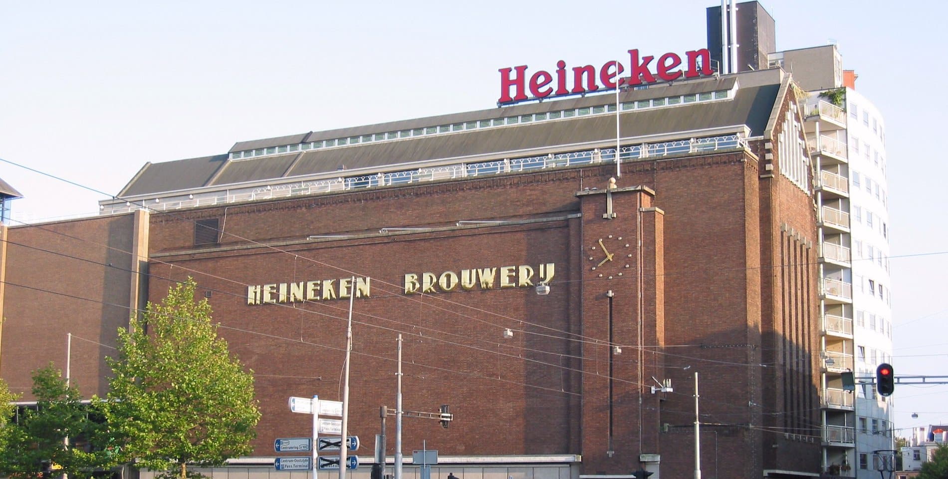 The former Heineken brewery on the Stadhouderskade, a long brick building with the gold Heineken Brouwerij lettering on its side and the red Heineken sign on the roof